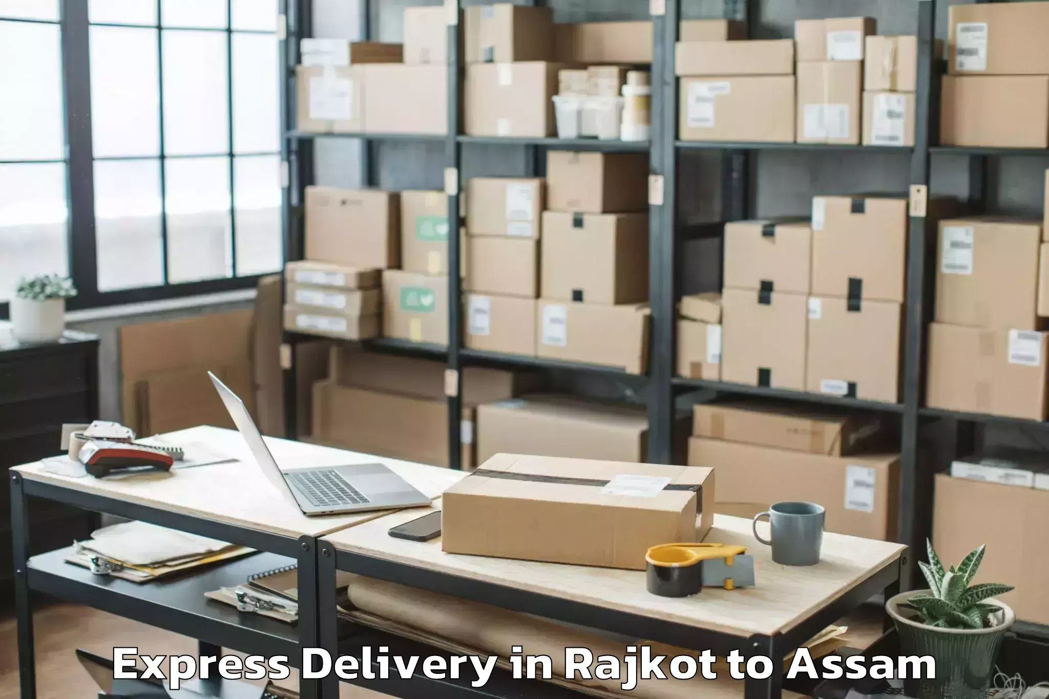 Quality Rajkot to Rajakhat Banekuchi Express Delivery